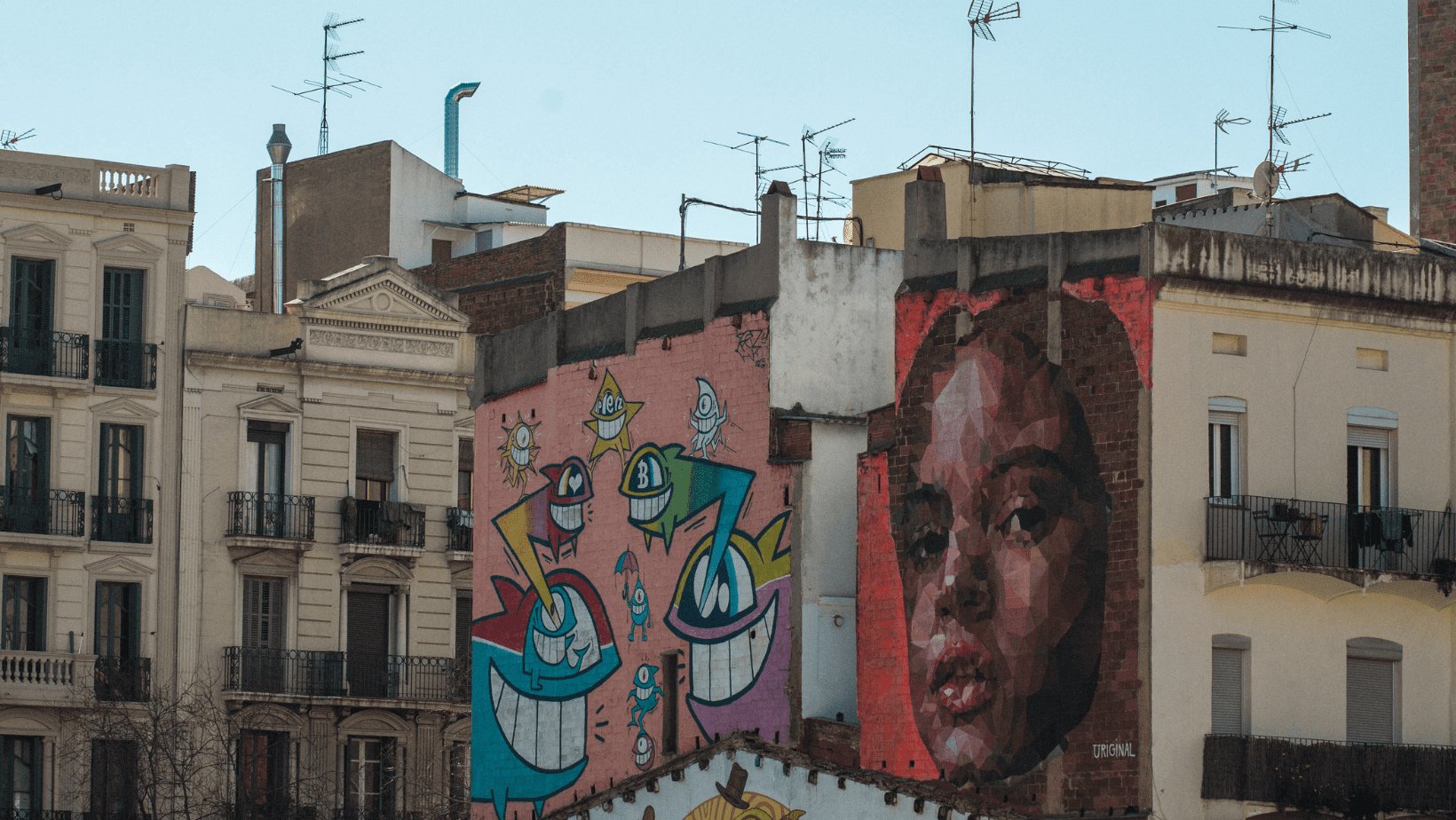 An artistic mural displayed on the side of a building, adding character and creativity to the urban landscape.