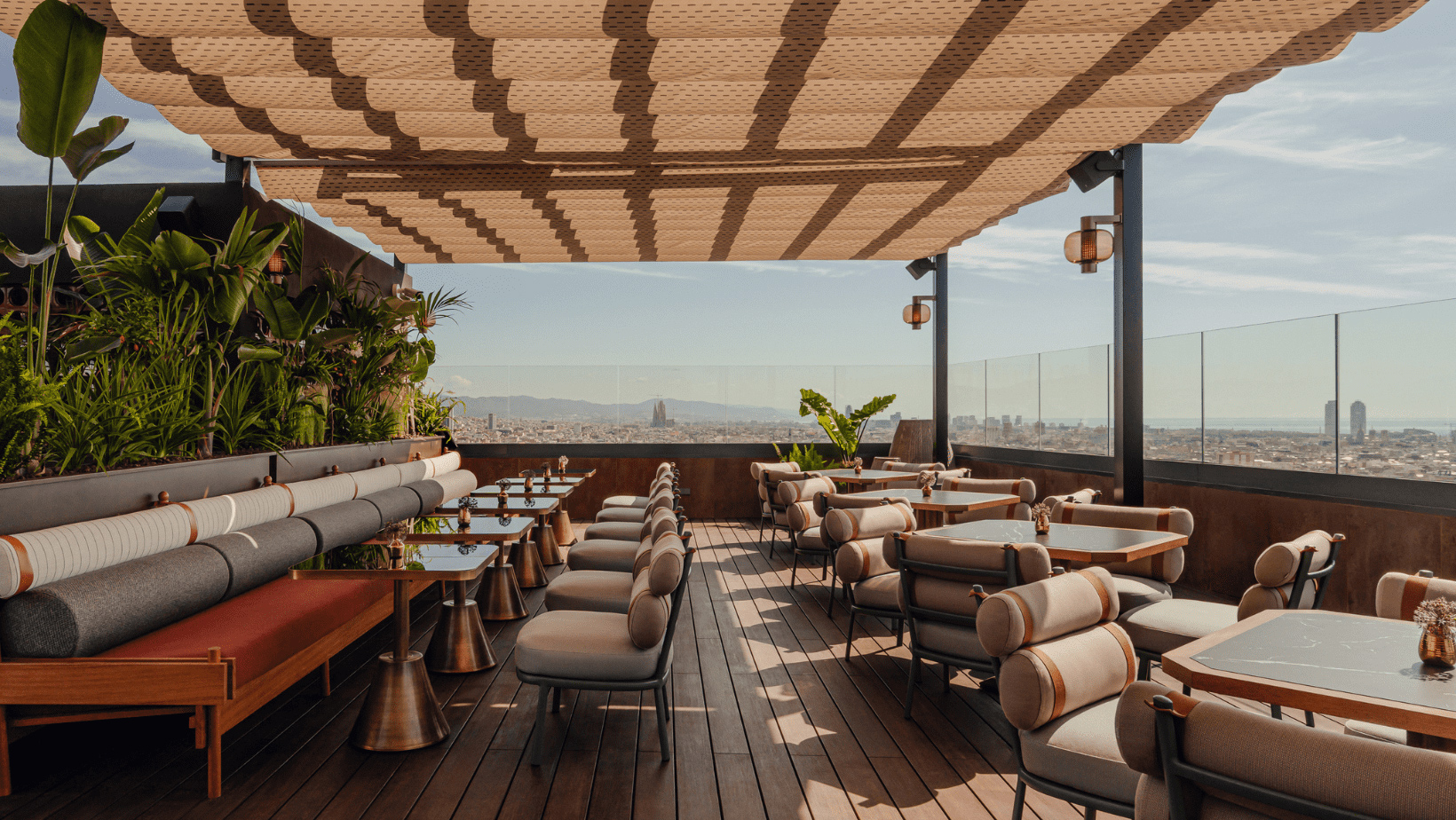 A rooftop terrace equipped with tables and chairs for enjoying fresh air and city views