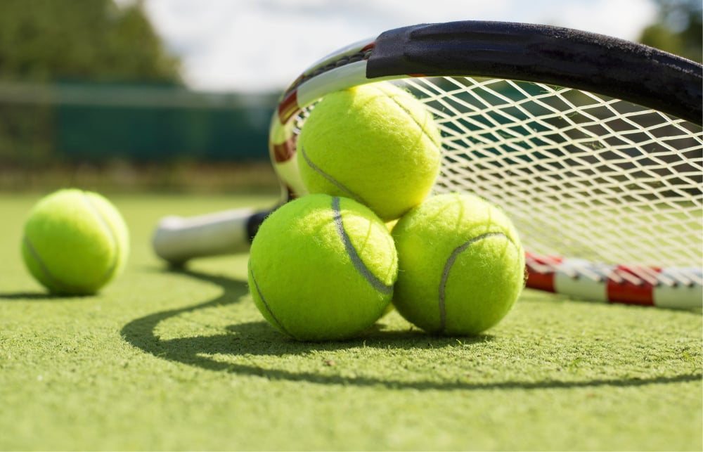 Tennis balls with racket