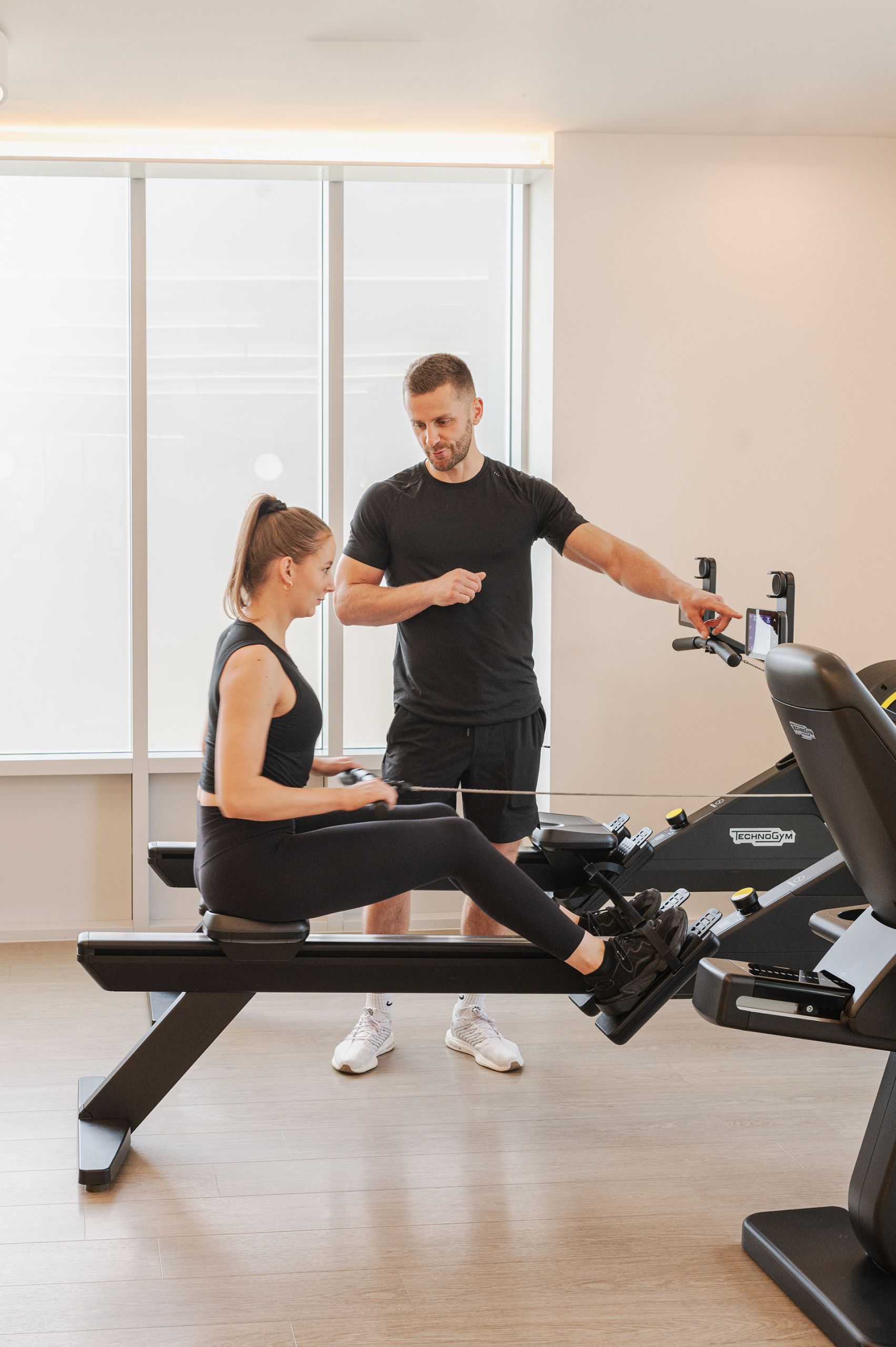 Women working out with rowing machine