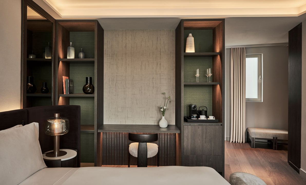 view of a desk and shelves in a bedroom