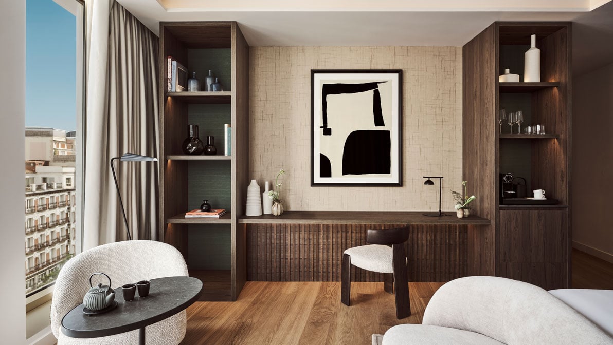 view of a desk between two shelves in a suite