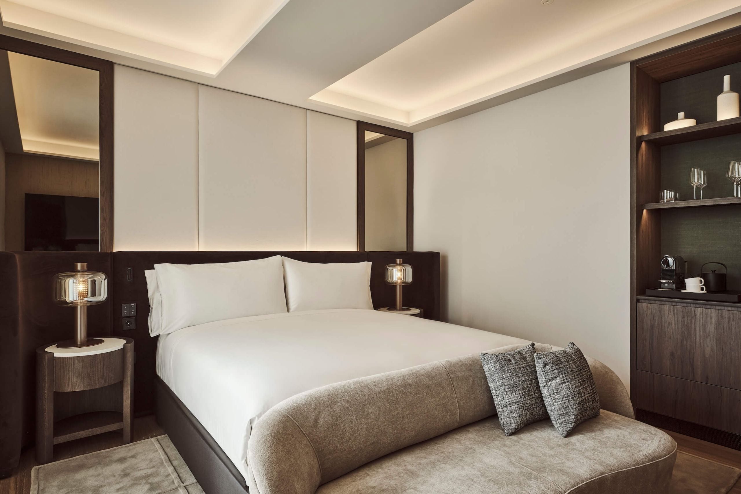 the bed and couch in the deluxe room
