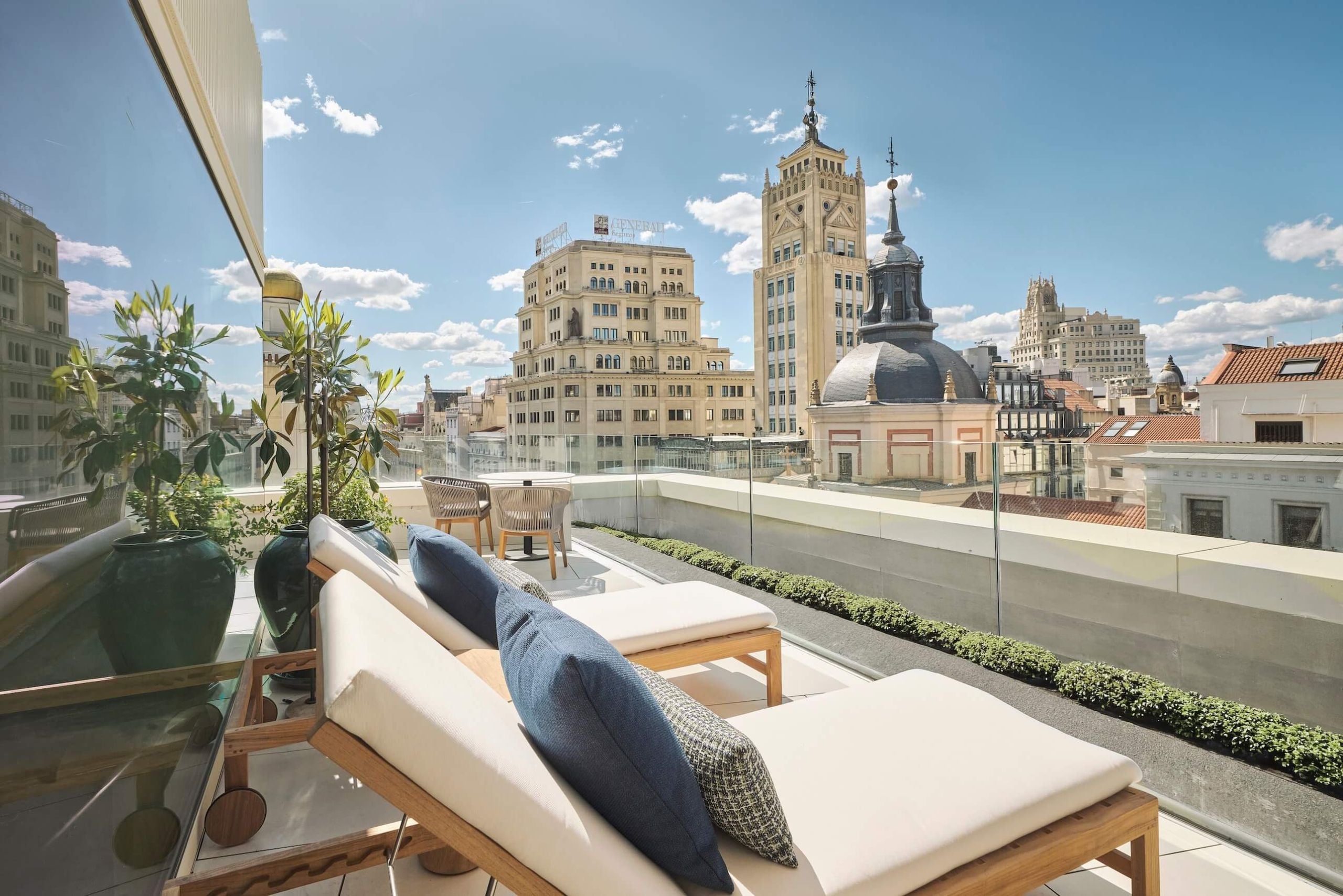 lounge chairs on the balcony of yuhi suite overlooking the site