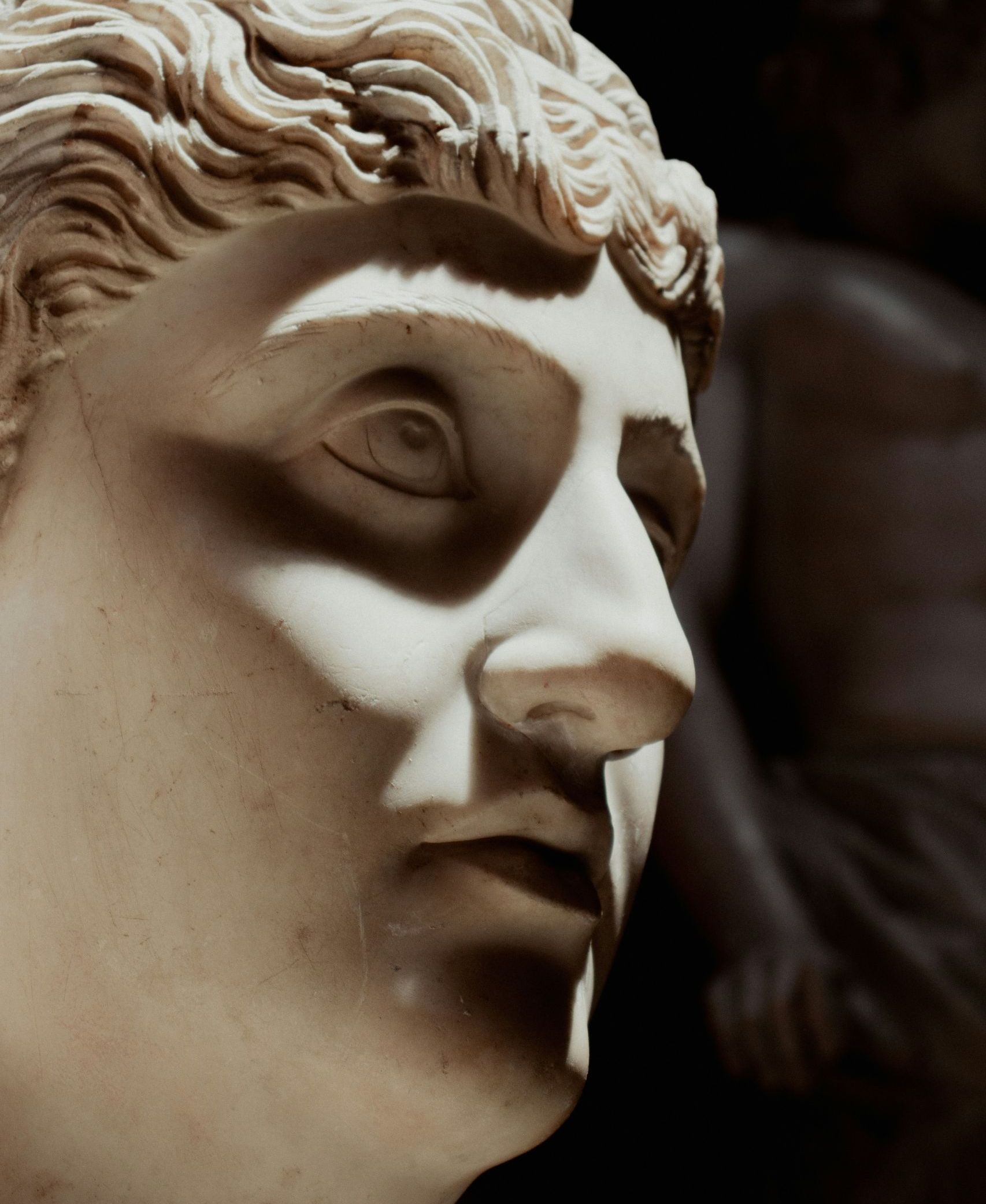 A carved roman statue head in Rome